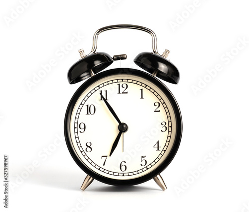 Closeup retro black alarm clock isolated on white background with clipping path