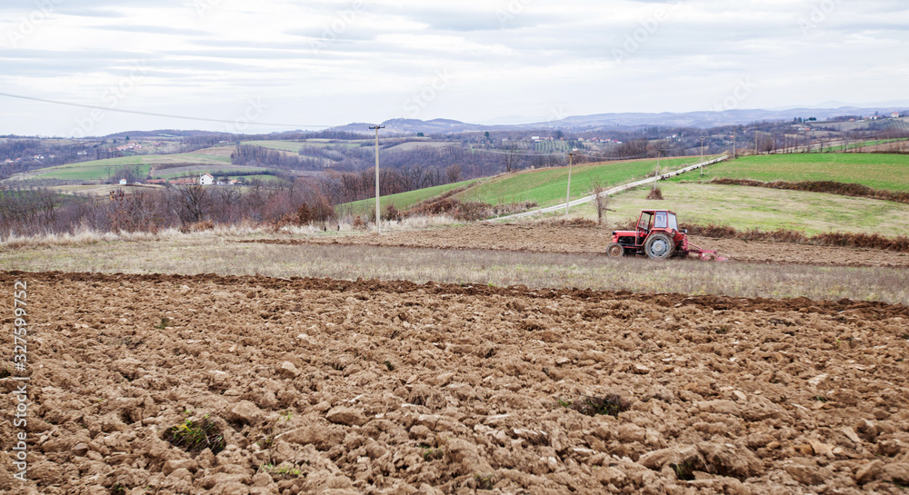 agricultural tractor plowing in the farmland agricultural tractor plowing in the farmland