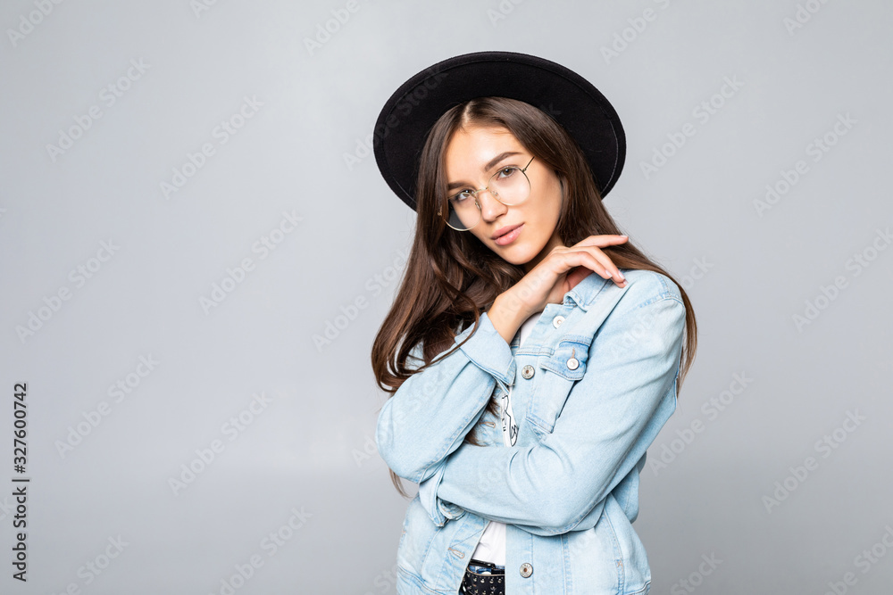 Portrait of young woman in black floppy hat isolated on white background Portrait of young woman in black floppy hat isolated on white background