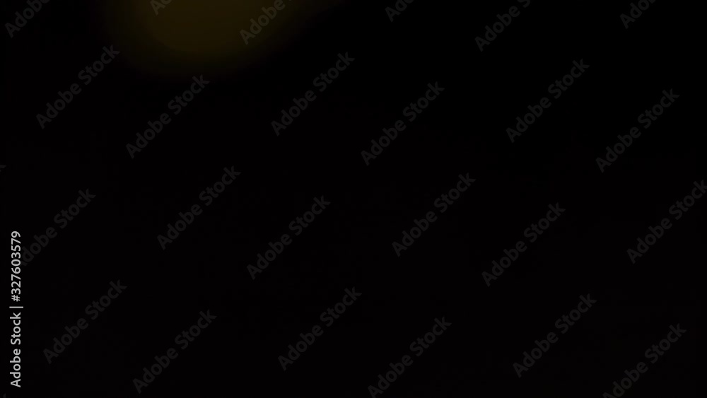 Yellow bokeh lights flashing across screen on background Yellow bokeh lights flashing across screen on background