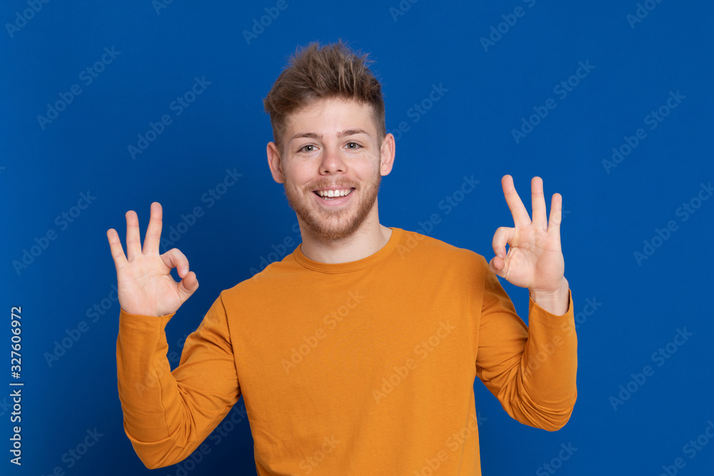 Attractive young guy with a yellow T-shirt Attractive young guy with a yellow T-shirt