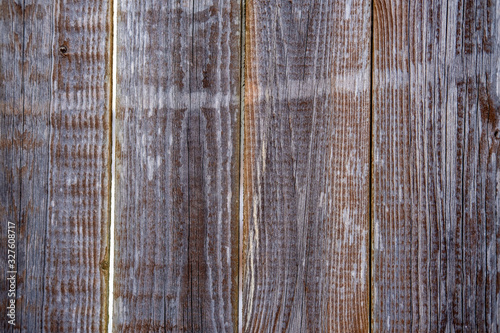 Background from an old textured and unpainted wooden fence.