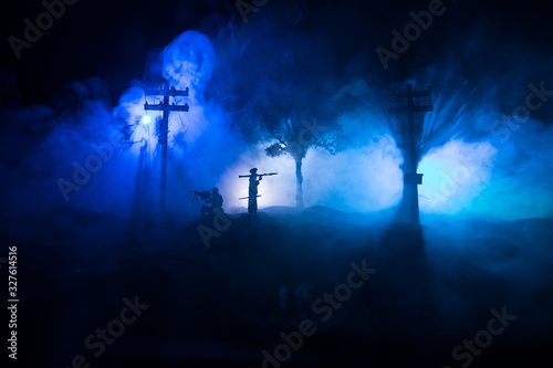 War Concept. Military silhouettes fighting scene on war fog sky background, photo