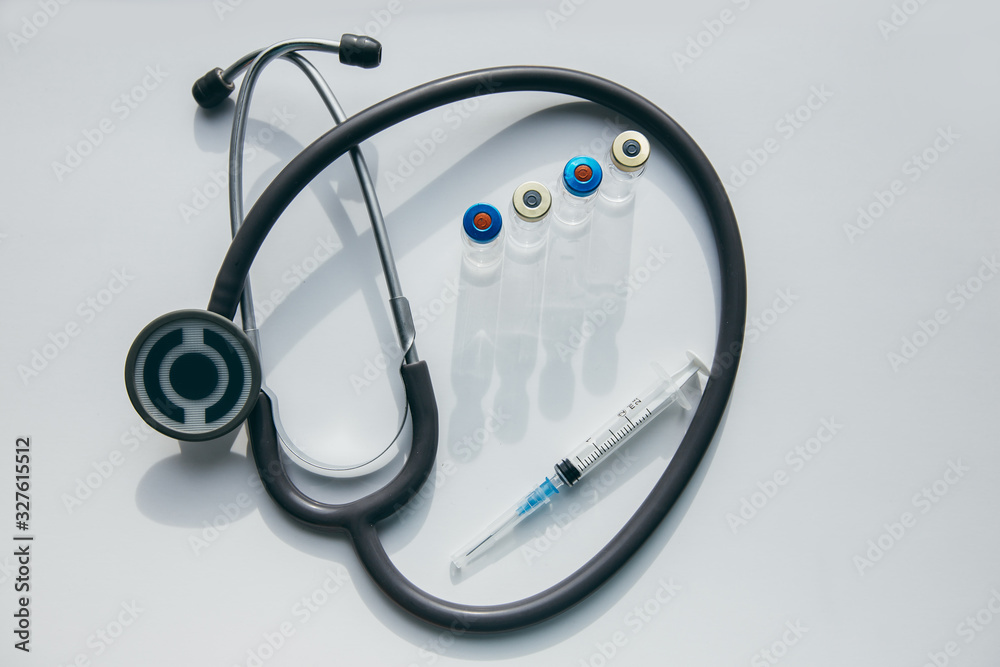 Vaccines bottles and syringe. Medical objects. Vaccines bottles and syringe. Medical objects.