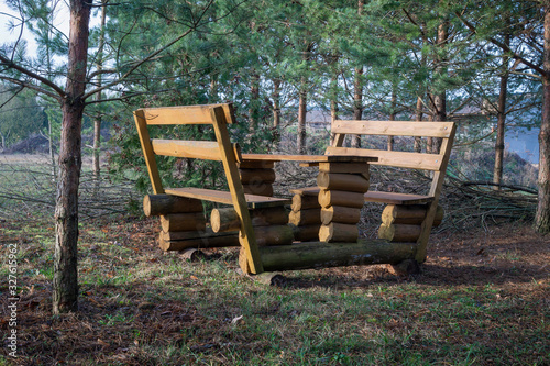 Rustic wooden picnic bench and table