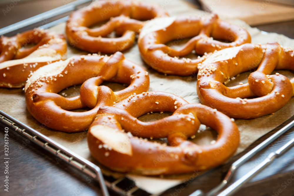 Closeup photo of handmade lye bun and pretzel in bakery Closeup photo of handmade lye bun and pretzel in bakery