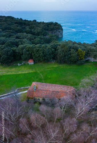 Ermita de San Emeterio, Landscape in the surroundings of the cave of the Pindal, lighthouse and hermitage of San Emeterio, Cantabrian Sea, Asturias, Spain, Europe photo