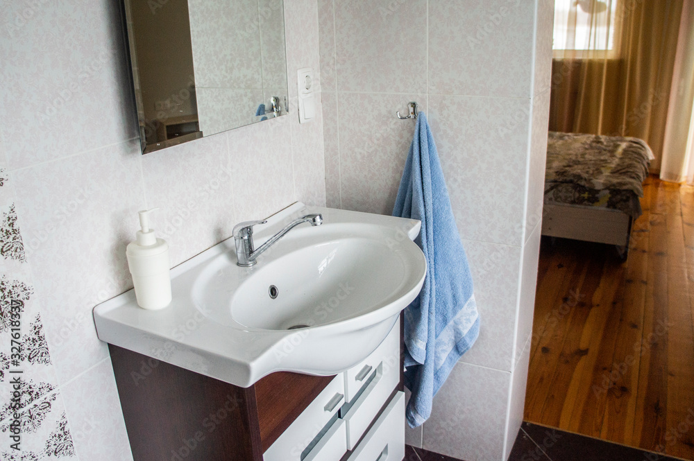 Washbasin with sink and faucet in the bedroom room. Minsk, Belarus - March 01 2020 Washbasin with sink and faucet in the bedroom room. Minsk, Belarus - March 01 2020