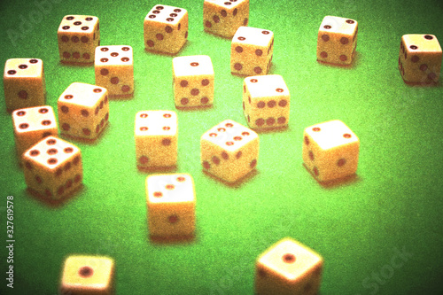 Dice in a casino on a green table in a retro setting.