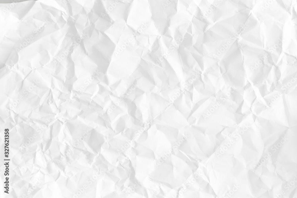 Obraz premium Crumpled on white background paper texture.