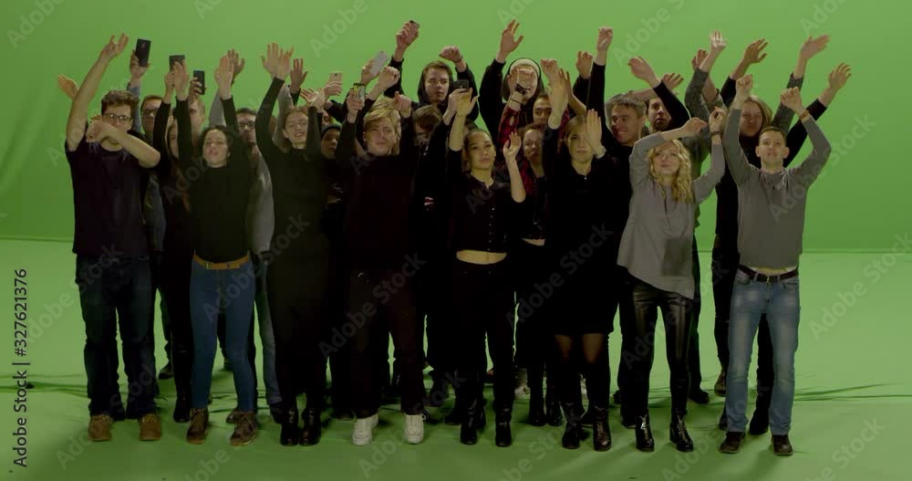 GREEN SCREEN CHROMA KEY Model released, Front view of huge crowd jumping and cheering at a concert or a show. Shot on RED Helium 8K in RAW