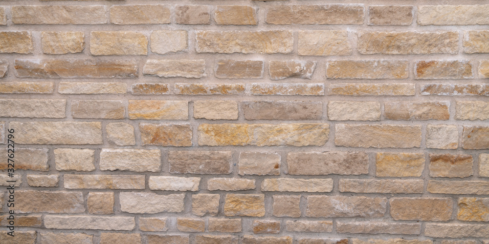 Stacked stone wall background horizontal clear brown sand texture