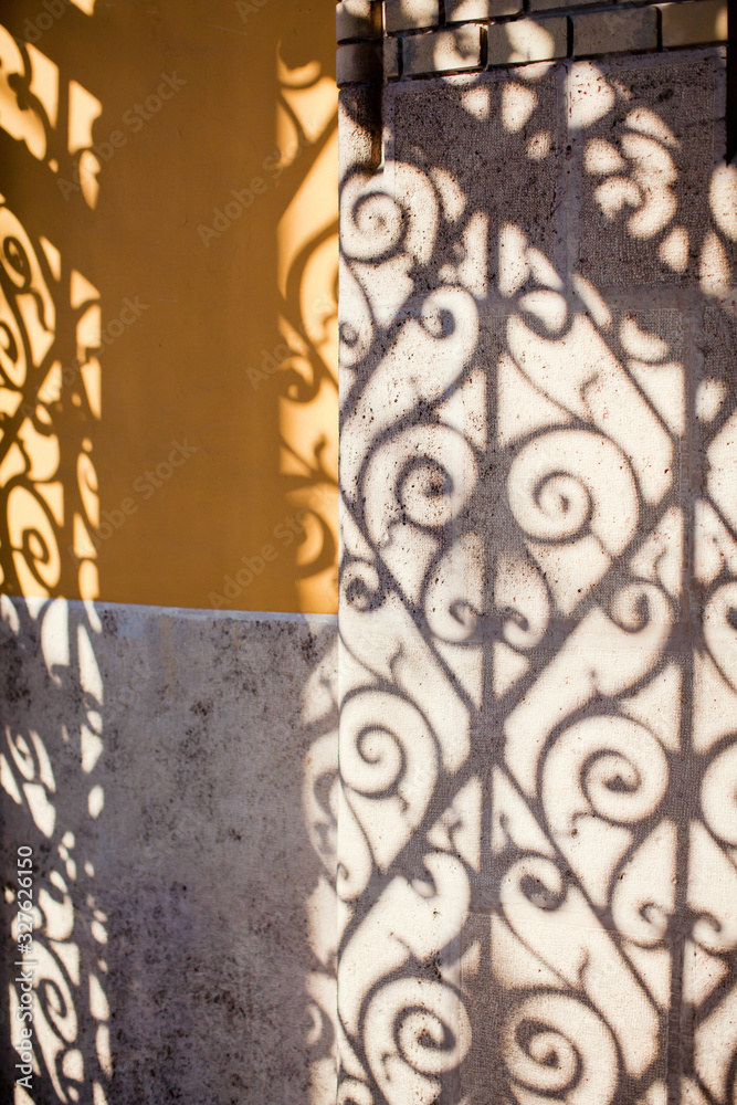 Shadow from a beautiful ornamented gate
