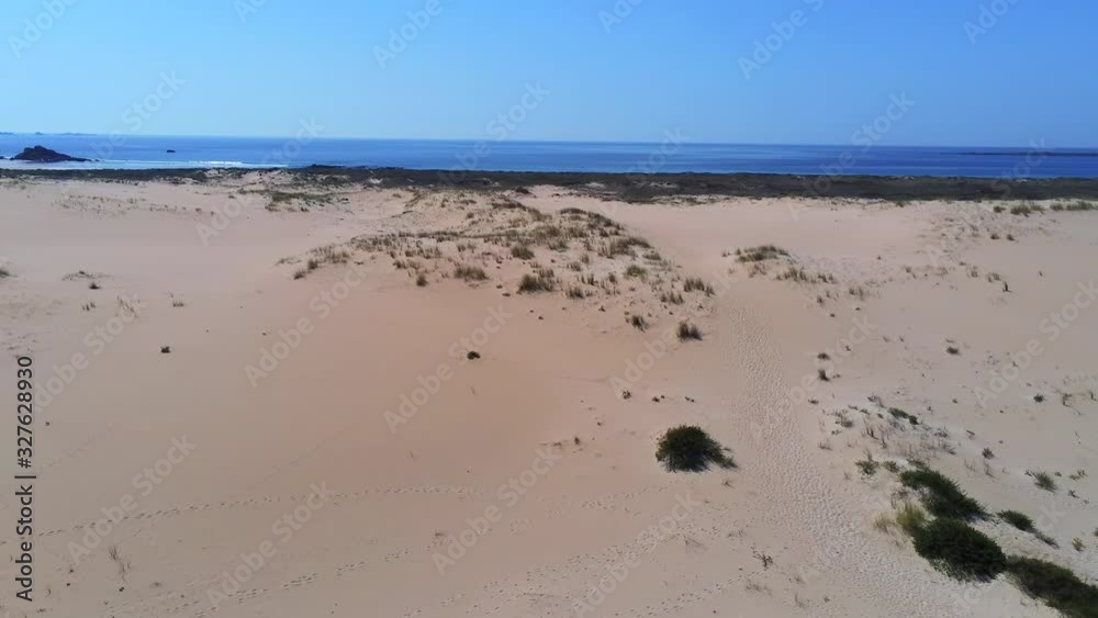 Pull up reveal Aerial shot of The Dunes of Corrubedo national park on the Atlantic coast of Spain.