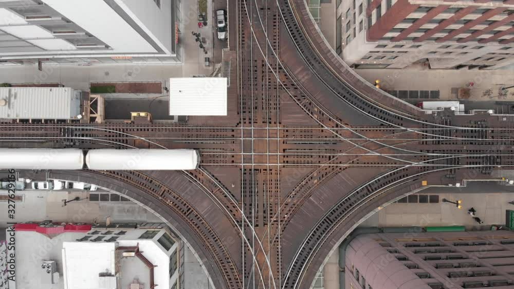Aerial view of a train in the cross of the loop circle line in downtown ...