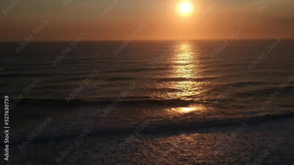 Sunset reflection over breaking waves Sunset reflection over breaking waves