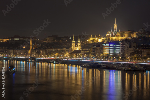 Danube river and illuminated historic boildings at night in Budapest, Hungary