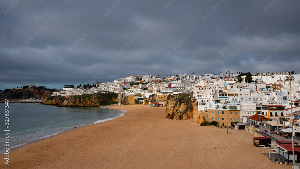 beautifull sandy beach and waves of the Atlantic Ocean. Albufeira, Algarve, Portugal. 