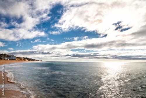 beautifull sandy beach and waves of the Atlantic Ocean. Albufeira, Algarve, Portugal.  © gusenych