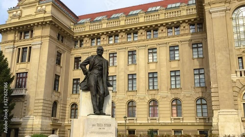 The Statue of Count Istvan Tisza In Front Of University Of Debrecen, In Hungary.- wide shot photo