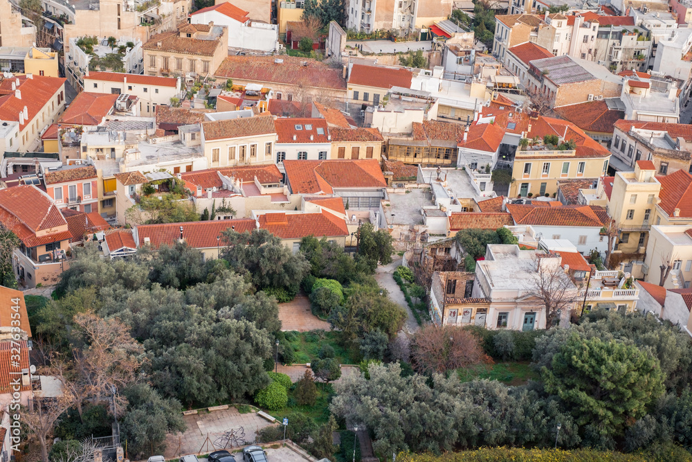 Obraz premium Aerial view of preserved historic buildings in the Plaka neighborhood of Athens, on the slopes of Acropolis, Greece