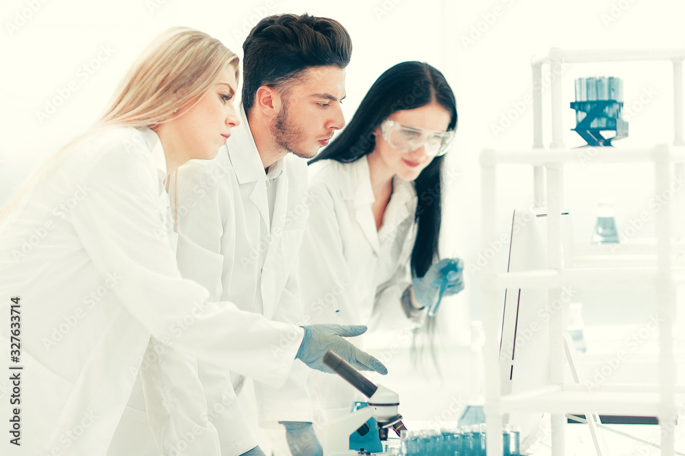team of young virologists are working on a vaccine against the coronavirus. team of young virologists are working on a vaccine against the coronavirus.