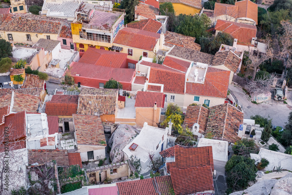 Naklejka premium Aerial view of preserved historic buildings in the Plaka neighborhood of Athens, on the slopes of Acropolis, Greece