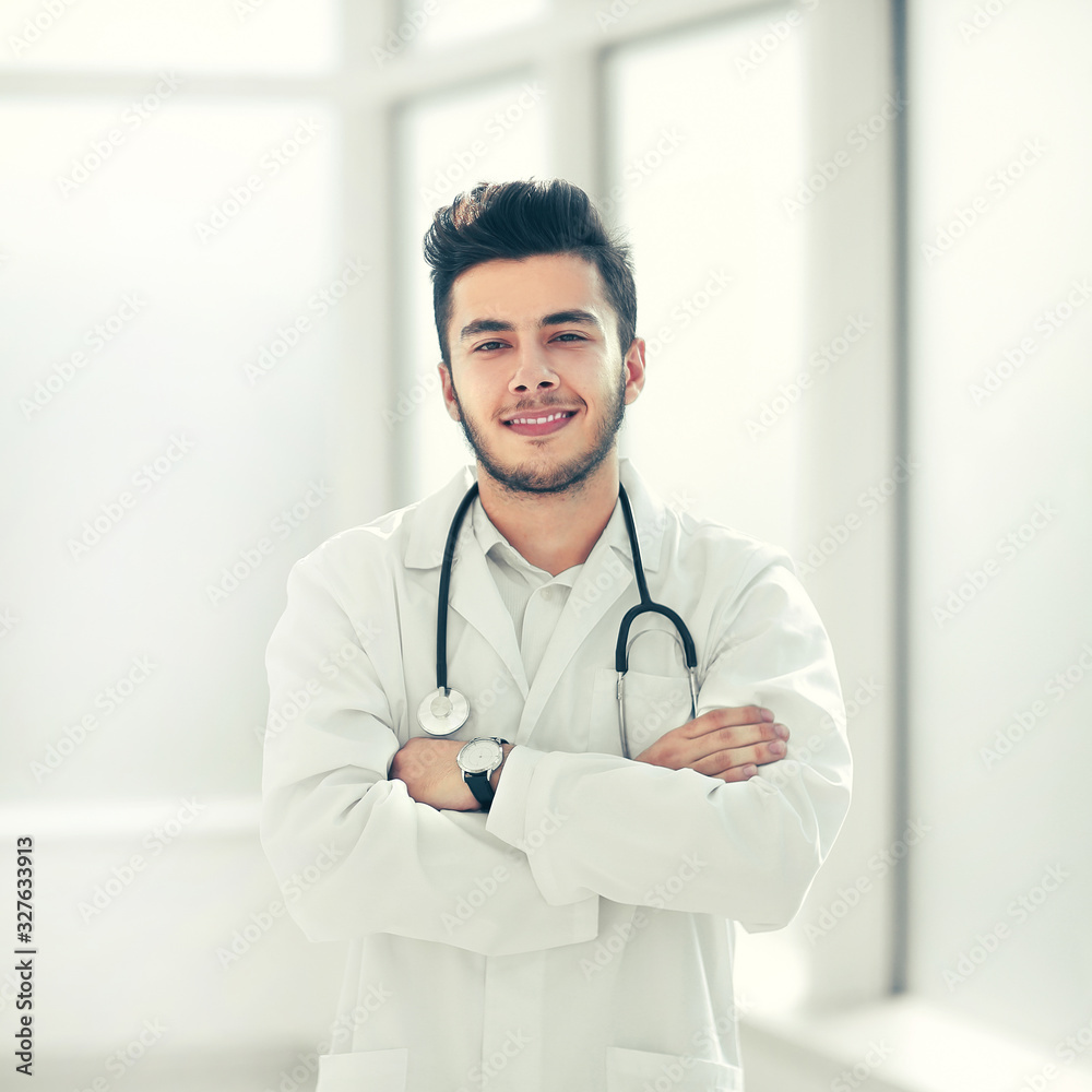 portrait of a physician therapist on a light background portrait of a physician therapist on a light background