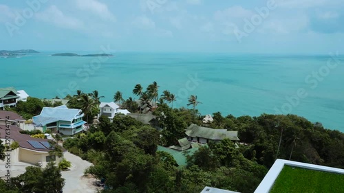 Beautiful blue or turquoise water in the pool overlooking the sea and landscape. An expensive and luxurious white villa with a blue pool. Travel and high. Interior