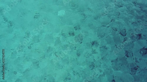 Beautiful blue or turquoise water in the pool overlooking the sea and landscape. An expensive and luxurious white villa with a blue pool. Travel and high. Interior