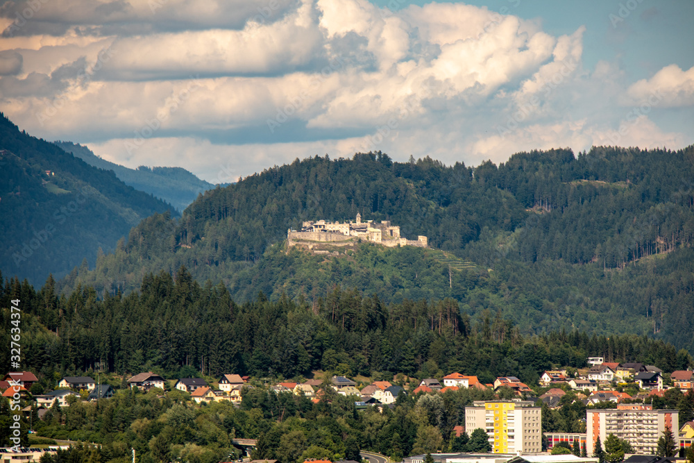 Panorama of the city of Villach with historical churches and a castle in front of the mountains of the Karawanken Mountains in the Austrian Alps,Europe