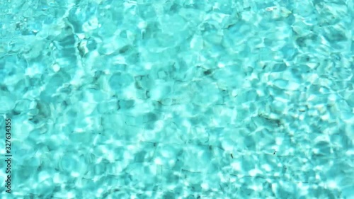 Beautiful blue or turquoise water in the pool overlooking the sea and landscape. An expensive and luxurious white villa with a blue pool. Travel and high. Interior