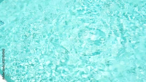 Beautiful blue or turquoise water in the pool overlooking the sea and landscape. An expensive and luxurious white villa with a blue pool. Travel and high. Interior