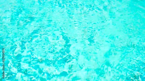 Beautiful blue or turquoise water in the pool overlooking the sea and landscape. An expensive and luxurious white villa with a blue pool. Travel and high. Interior