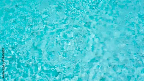 Beautiful blue or turquoise water in the pool overlooking the sea and landscape. An expensive and luxurious white villa with a blue pool. Travel and high. Interior