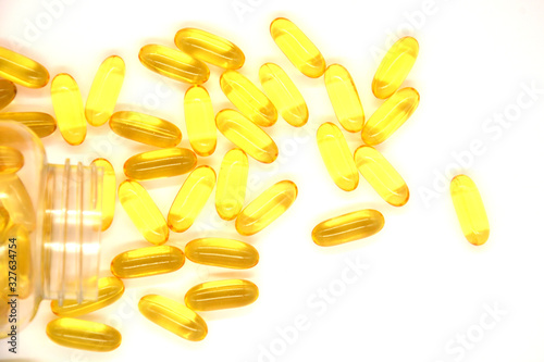 Fish oil capsules with omega 3 and vitamin D, healthy eating concept