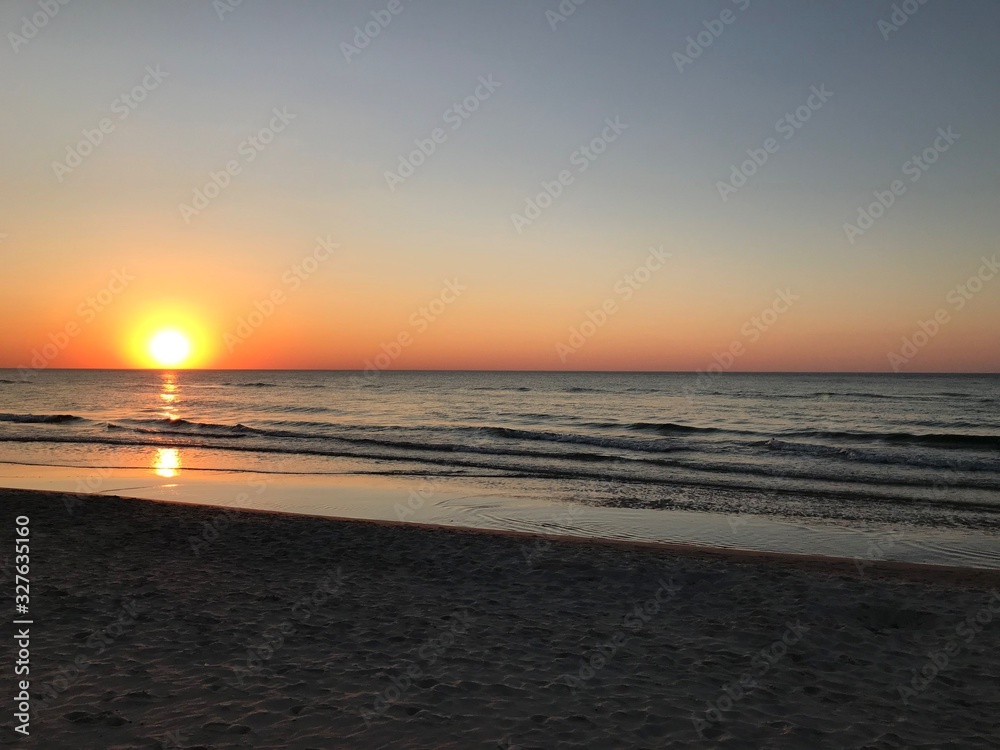 Naklejka premium Sunset at the beach