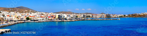 superb panoramic view of the port of Tinos, magnificent Cyclades island in the heart of the Aegean Sea, dominated by the Panaghia Evangélistria Church © Mariedofra