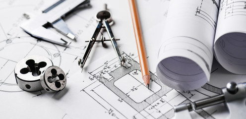 Technical drawings with measure tools. Pencil, measurement. Papers with technical drawings and diagrams on the table...C