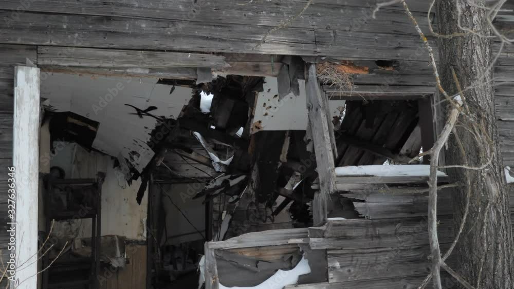 An Old Abandoned House with Caved in Roof. An Old Abandoned House with Caved in Roof.