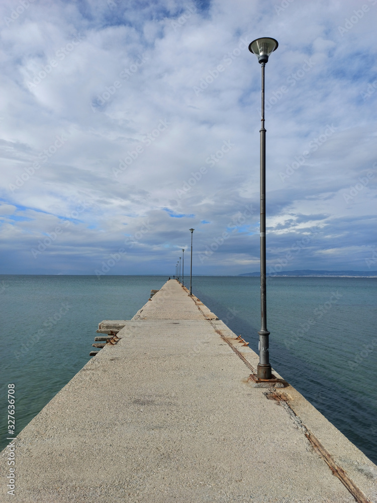 Panoramic view of a small old pier on the sea in Peraia, thessaloniki, greece