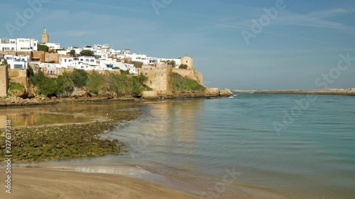 Static view of the Bou Regreg river and harbor that flows into the Atlantic at Rabat in Morocco with the ancient fortress overlookg the bay photo