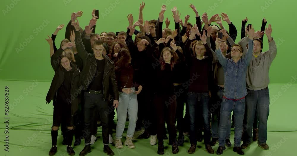 GREEN SCREEN CHROMA KEY Model released, Front view of huge crowd jumping and cheering at a concert or a show. Shot on RED Helium 8K in RAW