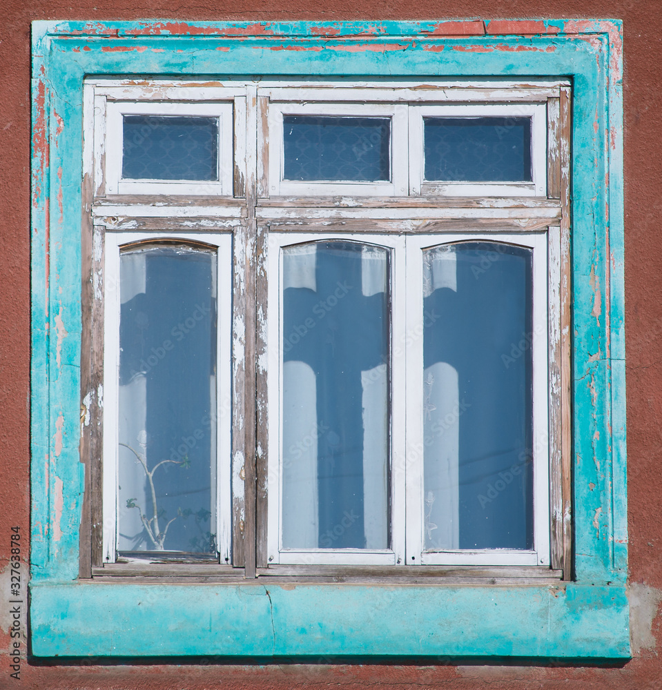 Old house with wooden window frames exterior Old house with wooden window frames exterior