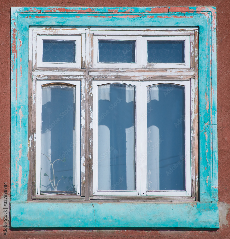 Old house with wooden window frames exterior