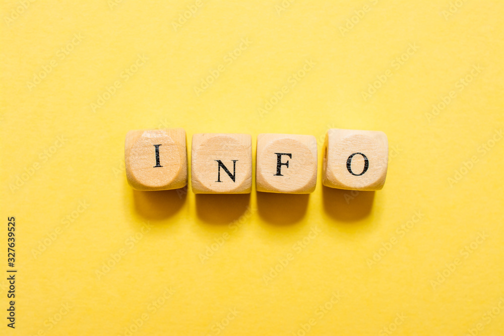 the word Info, text made with dice on yellow background the word Info, text made with dice on yellow background