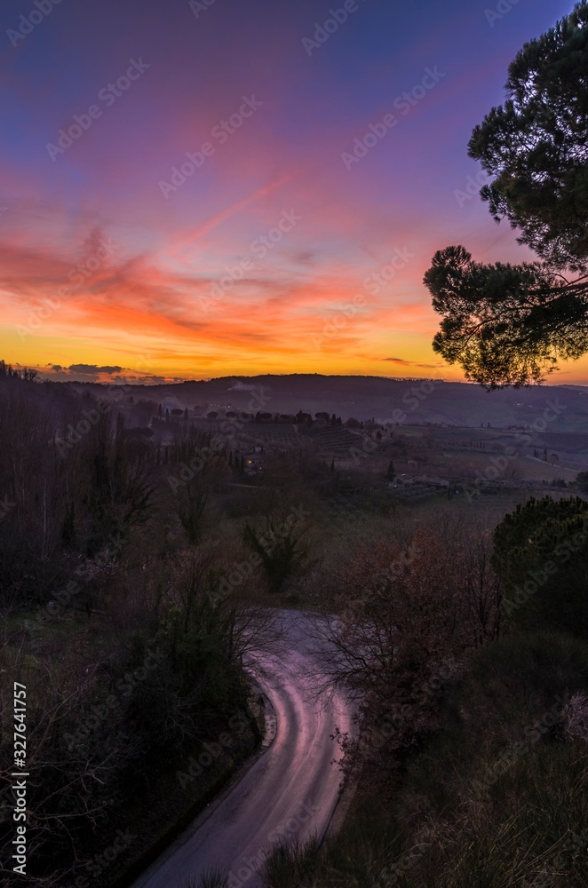 Beautiful multicolor sunset over country road Beautiful multicolor sunset over country road