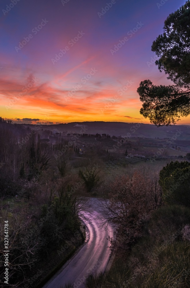 Beautiful multicolor sunset over country road Beautiful multicolor sunset over country road