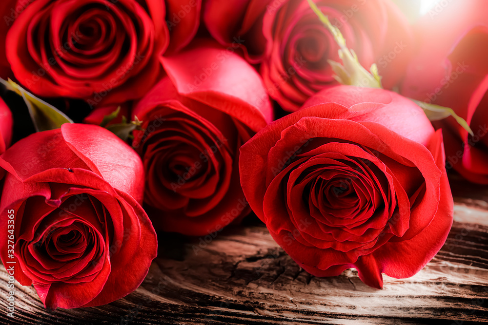 Red roses on old rustic table. Valentines day rose flowers. Red roses on old rustic table. Valentines day rose flowers.