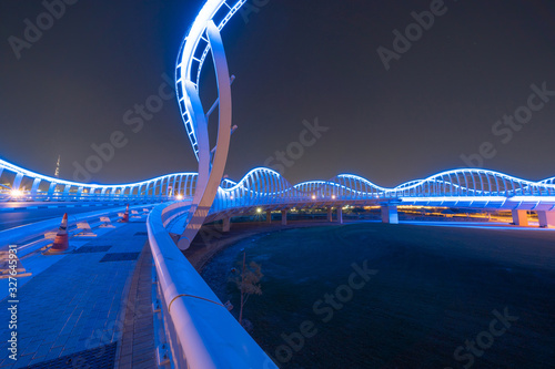 Photography Meydan Bridge and street road or path way on highway with modern architecture buildings in Dubai Downtown at night, urban city at night, United Arab Emirates or UAE